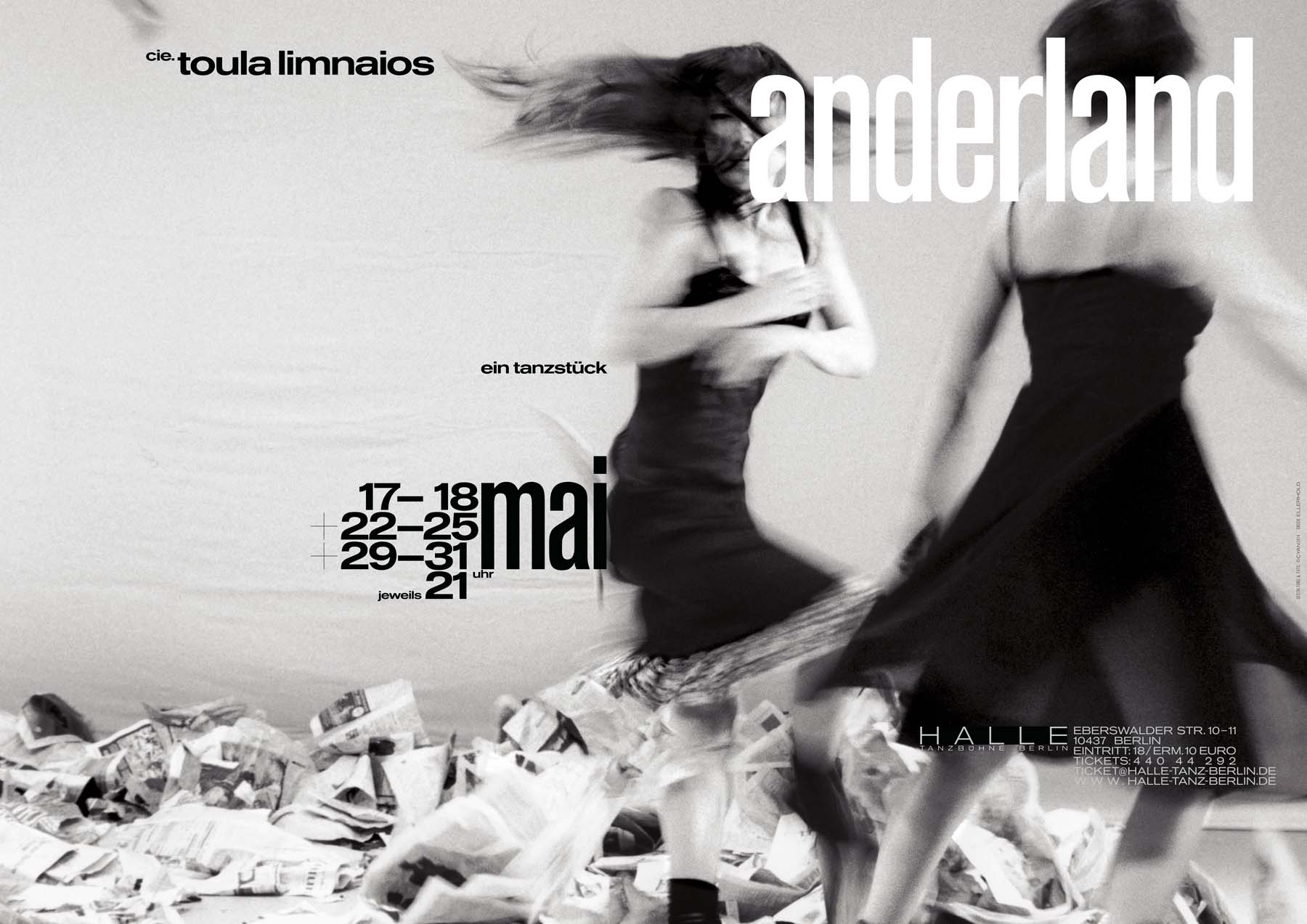 Poster for the dance piece »anderland« by cie. toula limnaios showing two dancers in black and white moving quickly with motion blur among piles of paper.